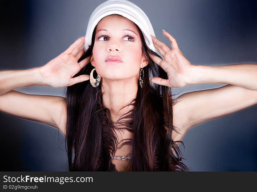 Beautiful brunette with retro bonnet, studio shot