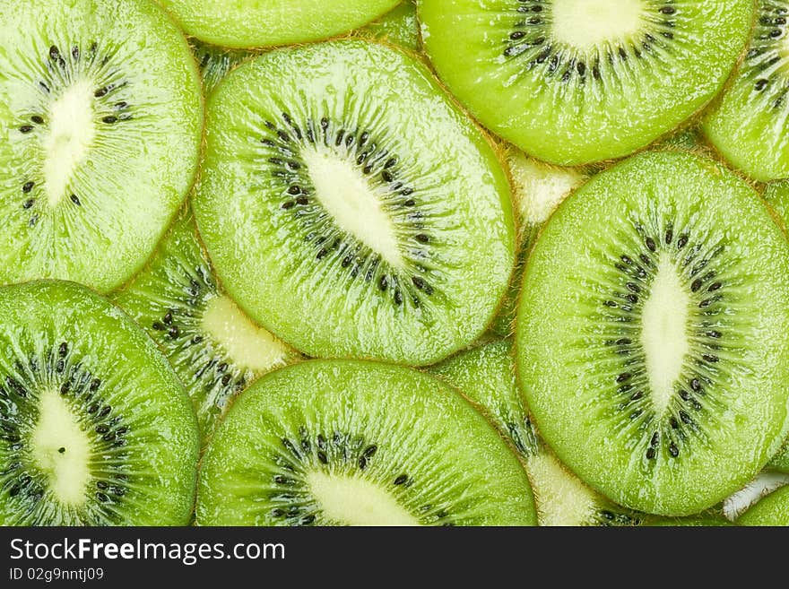 Background with the image of kiwi in a white plate. Background with the image of kiwi in a white plate