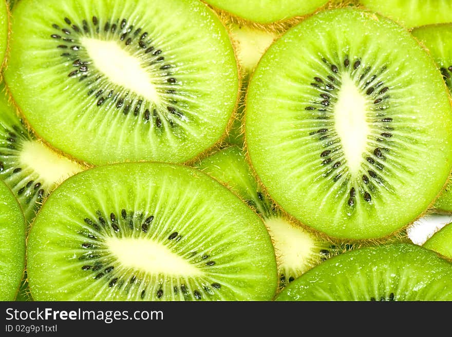 Background with the image of kiwi in a white plate. Background with the image of kiwi in a white plate