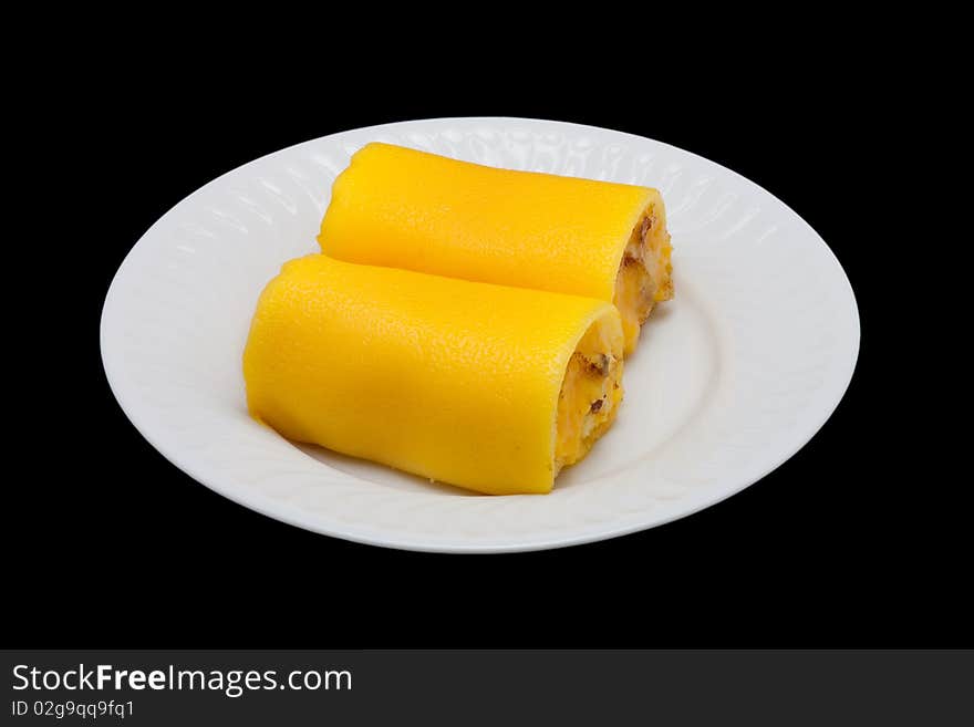 Cake in a plate isolated on the black