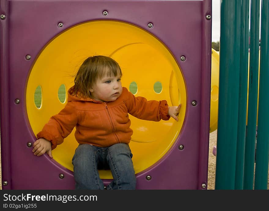 Child playing in the jungle gym. Child playing in the jungle gym