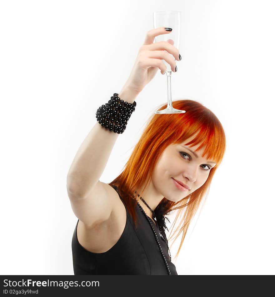 Beautiful red-haired girl lifts a toast, a glass with champagne