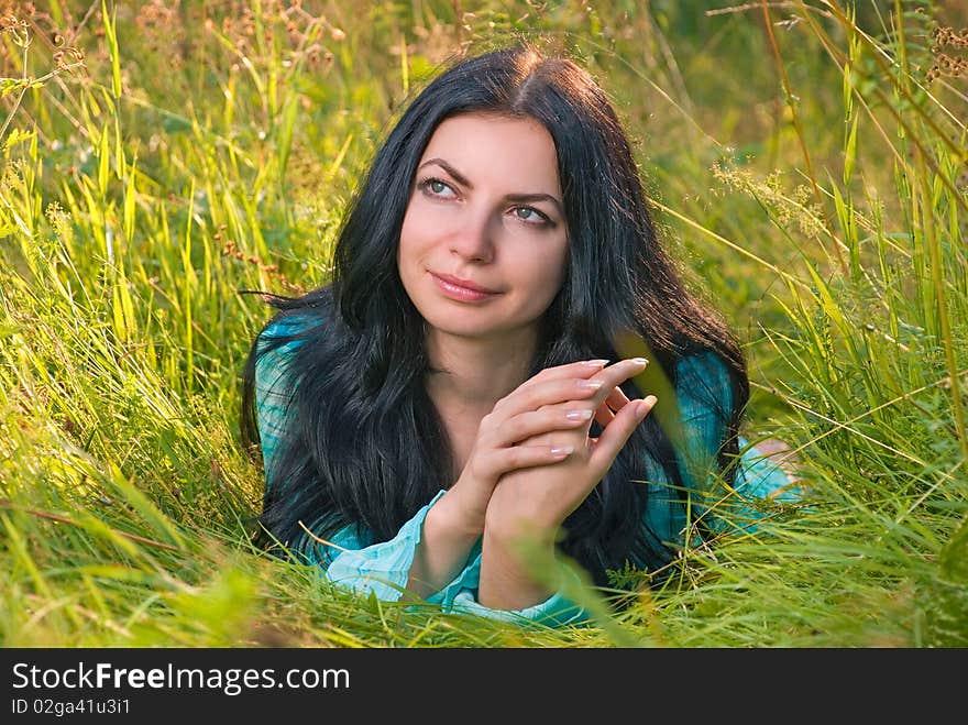 Young woman in grass