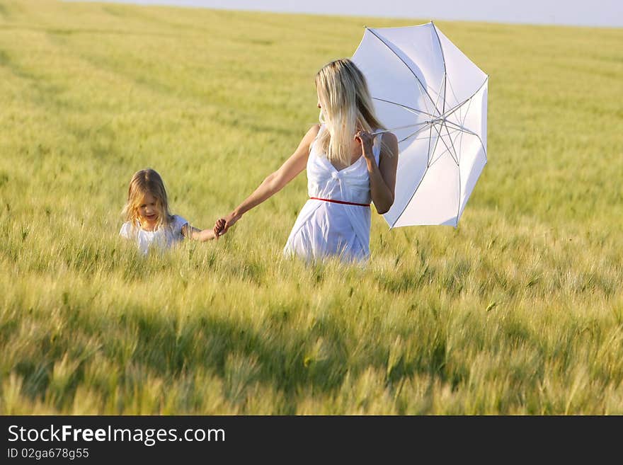 Mother and daughter in field