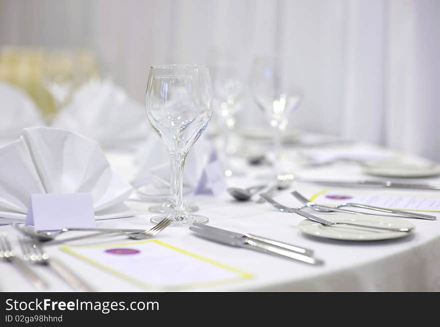 Empty place cards on the white festive table