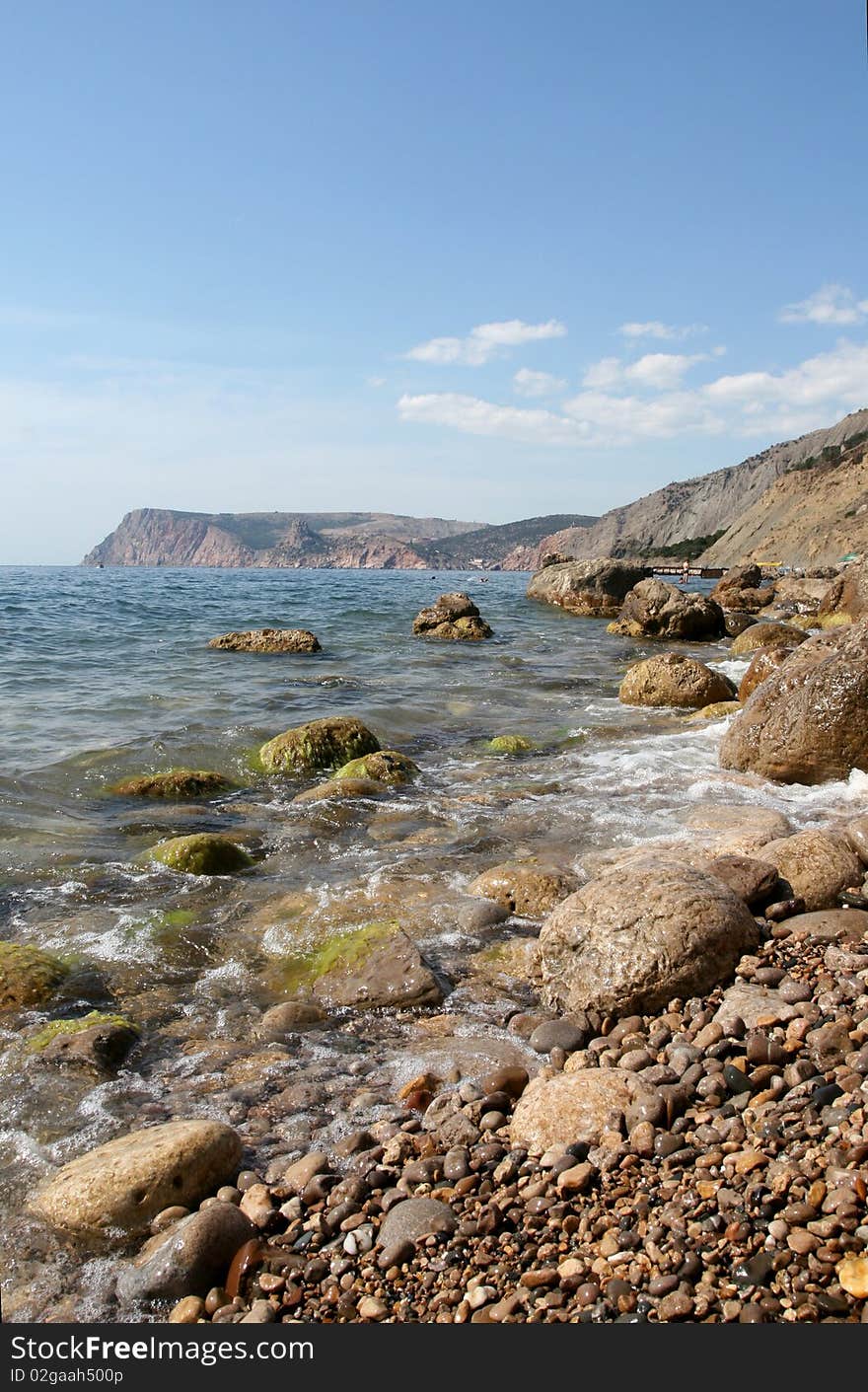 The stony sea-beach in the summer