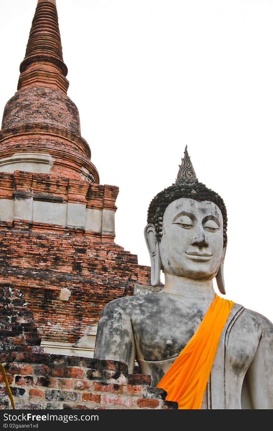 The ancient Buddha statue in front of the pagoda, Ayutthaya, Thailand. The ancient Buddha statue in front of the pagoda, Ayutthaya, Thailand