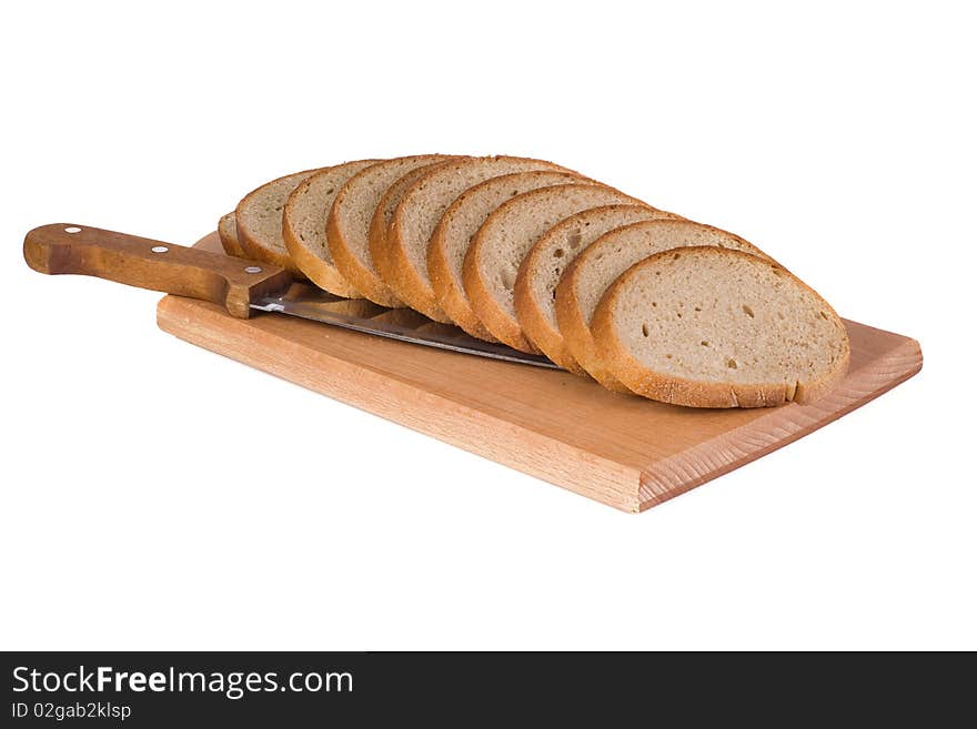 Bread and knife on wood cutting board. Bread and knife on wood cutting board