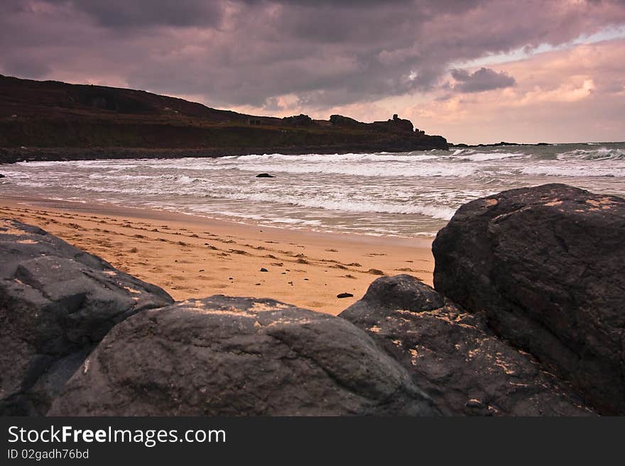 Headland rocks sea and sand. Headland rocks sea and sand