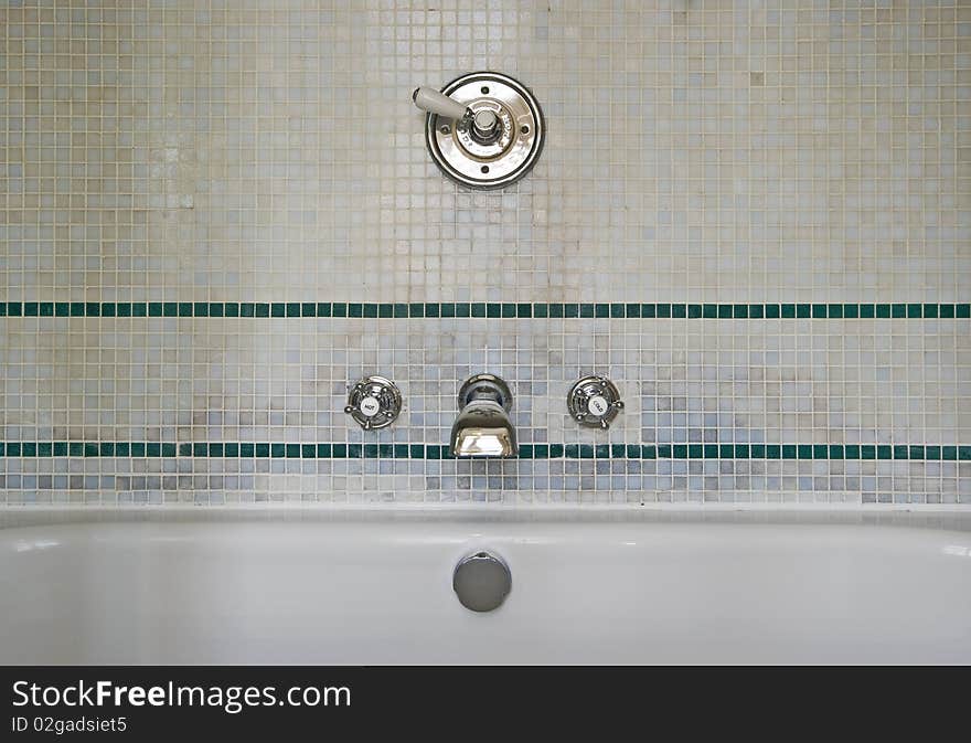 Bathroom detail of a classic style wall mount water tap