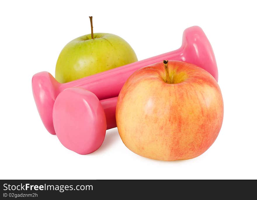 Two pink dumbbells and two apples on a white background. Two pink dumbbells and two apples on a white background