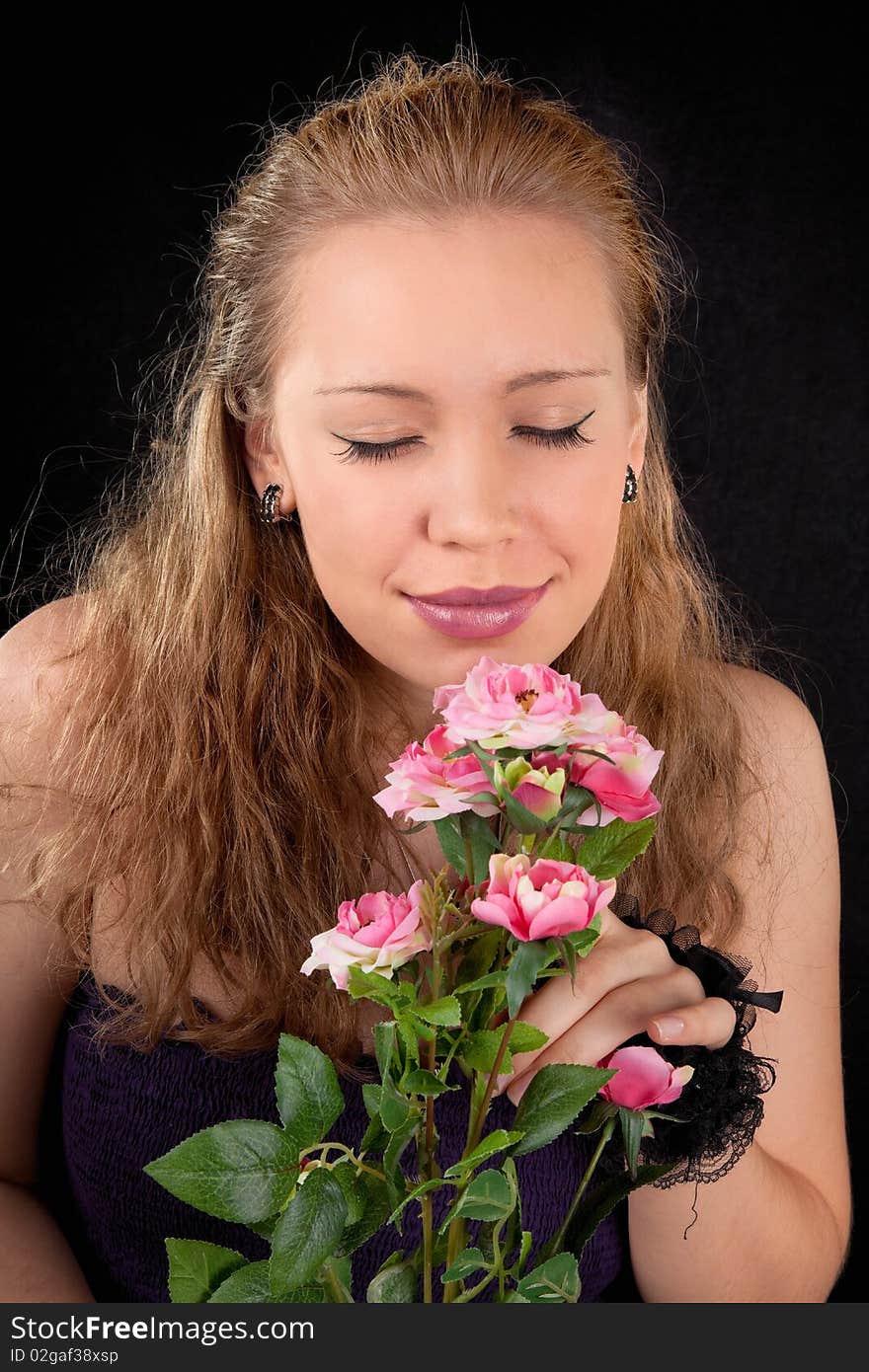 Portrait of a young girl with a flower roses. Portrait of a young girl with a flower roses