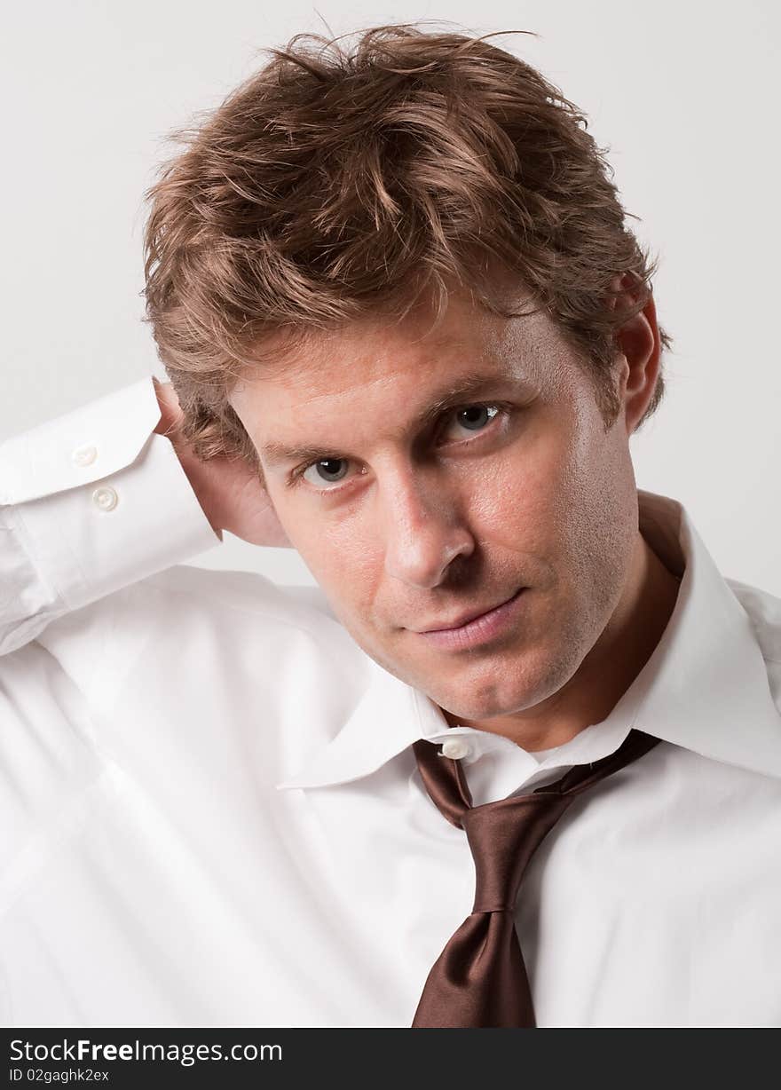 Smiling Man in White Shirt and Tie