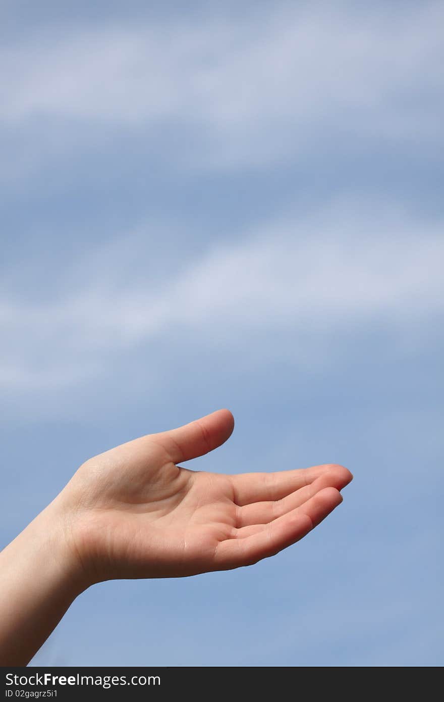 Photo of hand on sky background