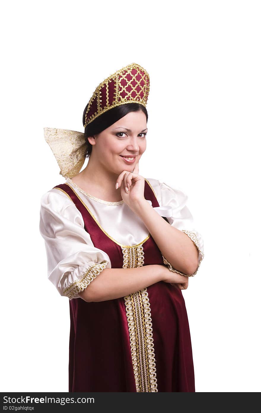 Girl standing in Russian traditional costume. Woman is wearing sarafan and kokoshnik . The girl in red old russian dress. Isolated on white. Girl standing in Russian traditional costume. Woman is wearing sarafan and kokoshnik . The girl in red old russian dress. Isolated on white.