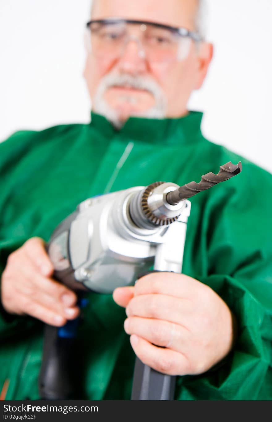 Construction worker holding the electric hand drill. Construction worker holding the electric hand drill