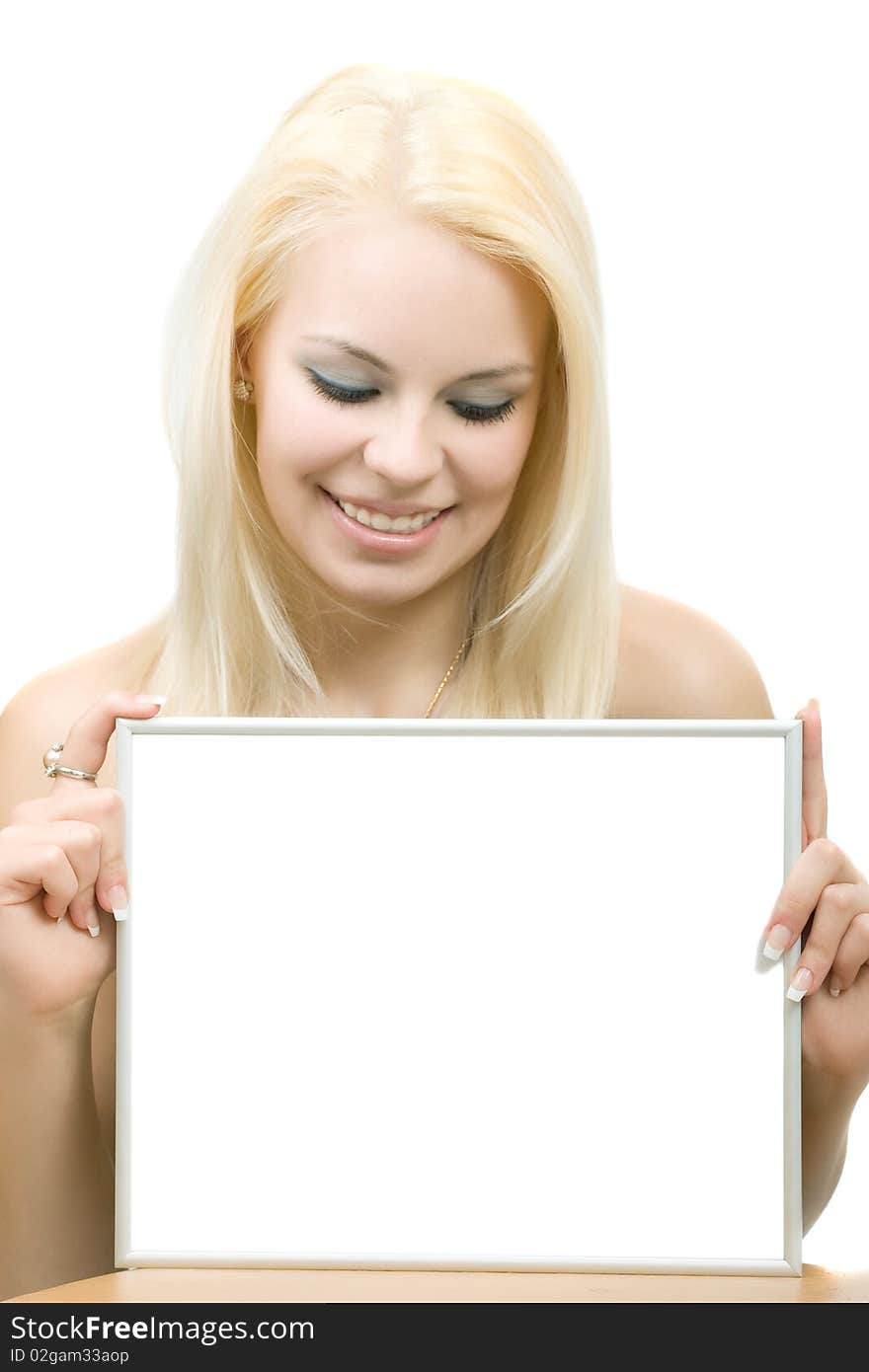 Young blonde smiling woman with blank. Looking down. Isolated on the white