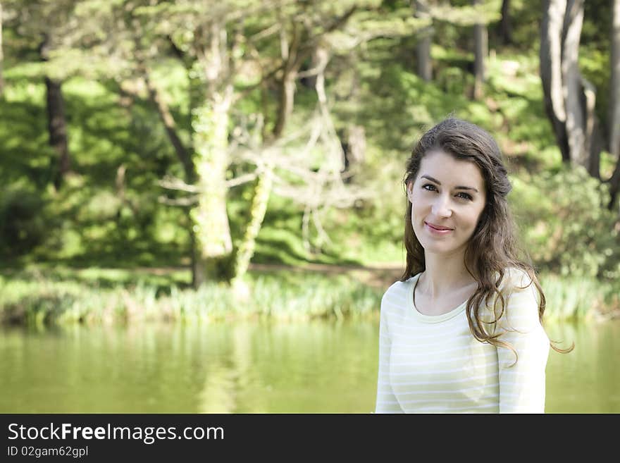 Portrait of a Pretty Young Woman Looking Up To The Sky in a Park. Portrait of a Pretty Young Woman Looking Up To The Sky in a Park