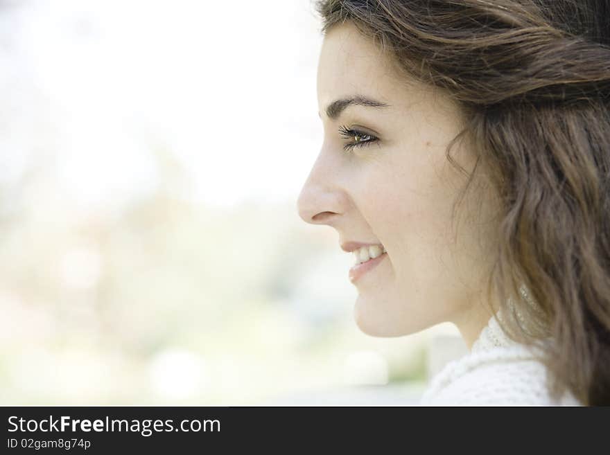 Profile of a Beautiful Young Woman Outdoors. Profile of a Beautiful Young Woman Outdoors