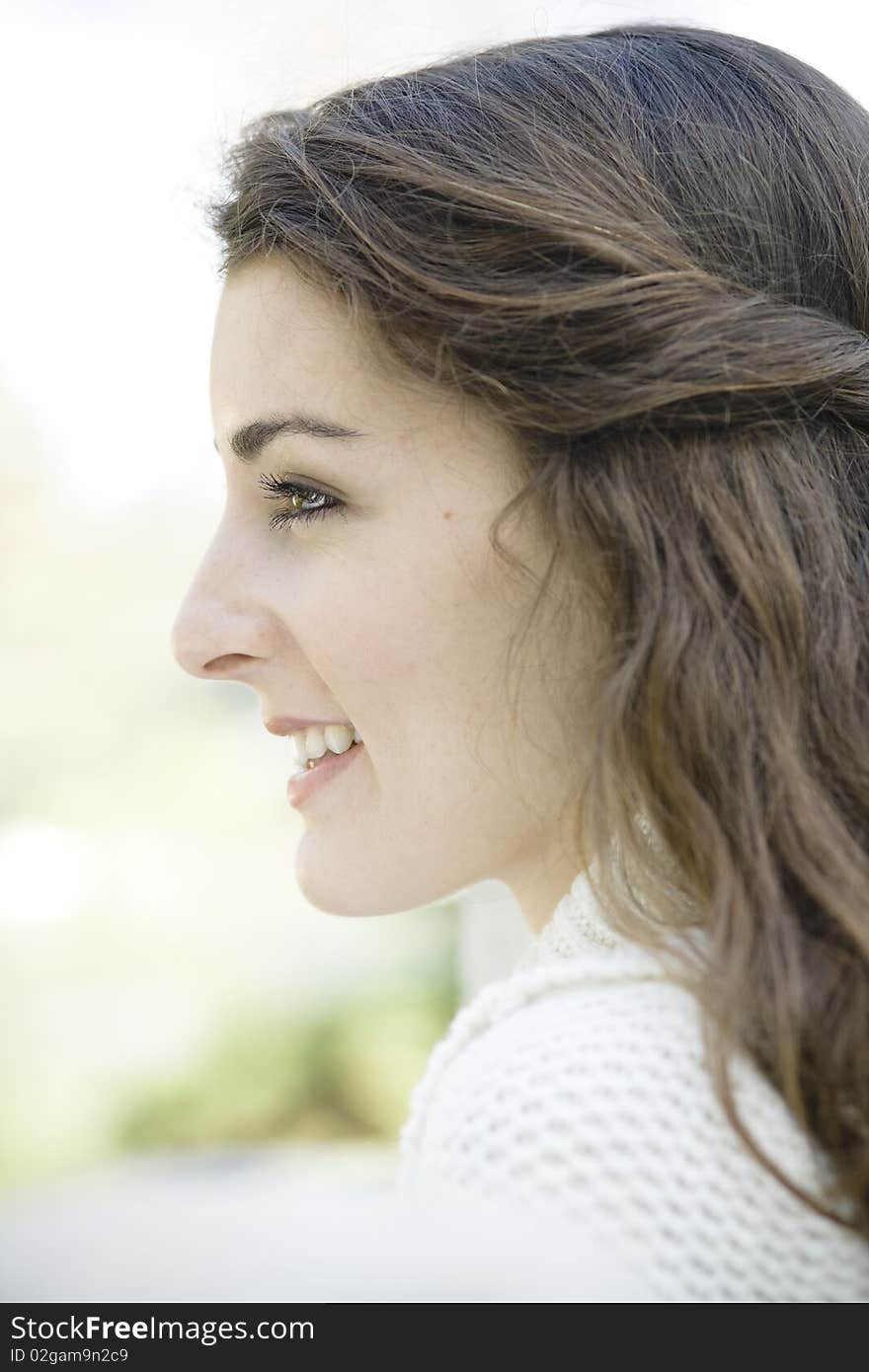 Profile of a Beautiful Young Woman Outdoors