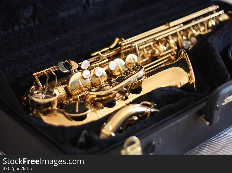 Shiny golden sax in black velvet case