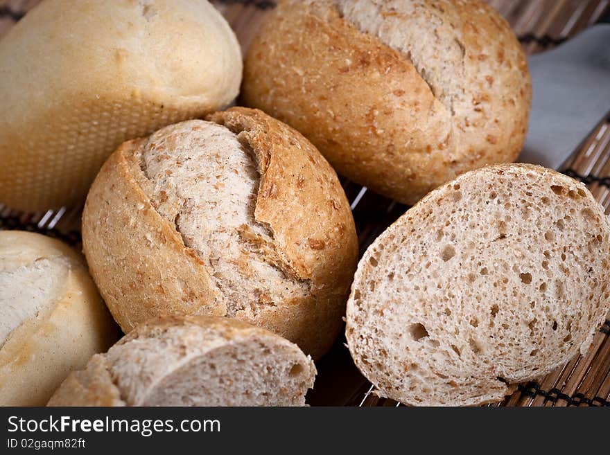 Rye and wheat french bread, baked in a wood oven. Selective focus. Rye and wheat french bread, baked in a wood oven. Selective focus.