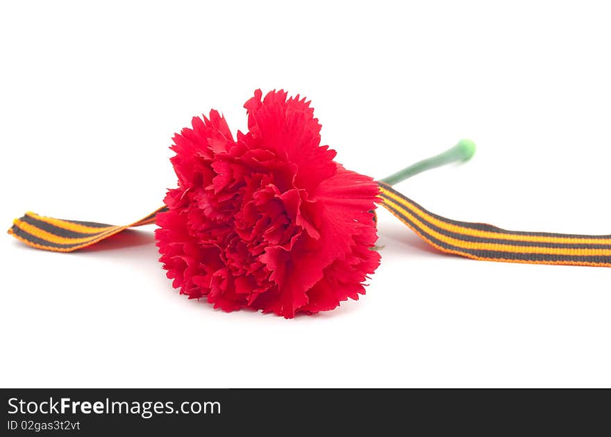 It's the ribbon of Saint George and carnation. Symbols of Russian Victory Day of Second World war.