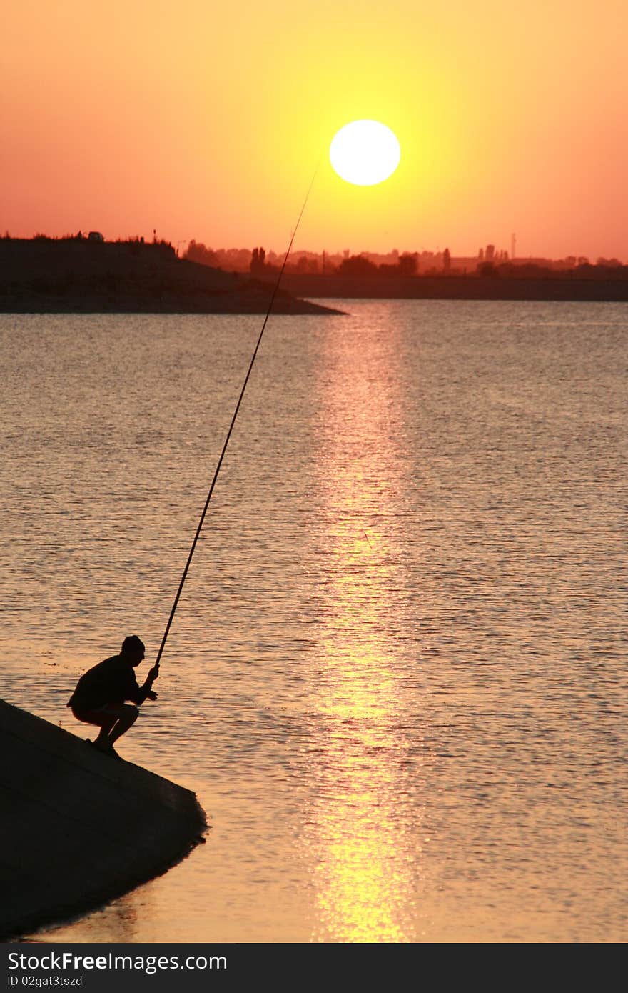 Twilight fisherman