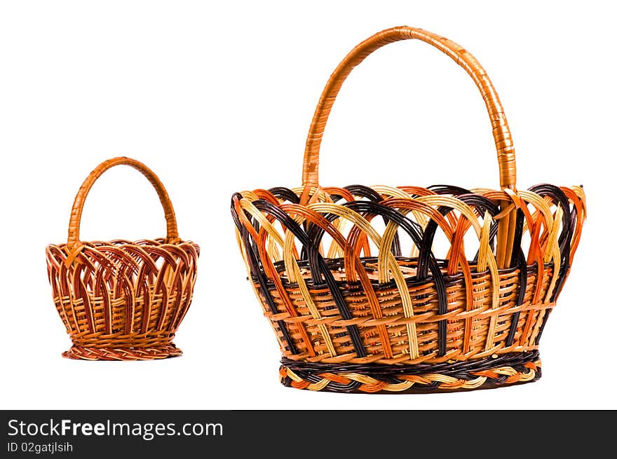 Traditional wicker baskets isolated on white background. Focus on the big basket.