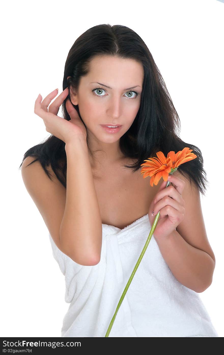 Young woman in towel with flower. Young woman in towel with flower