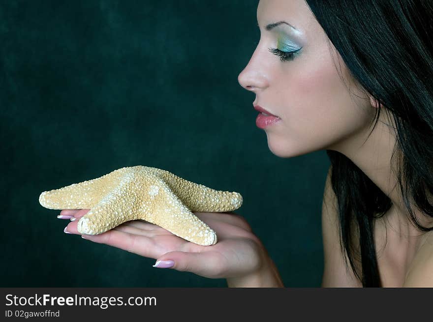 Beauty brunette with sea shell. Beauty brunette with sea shell