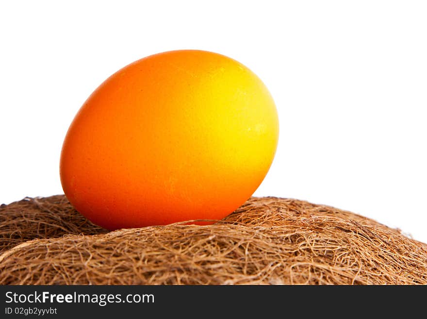 Colored egg in the straw