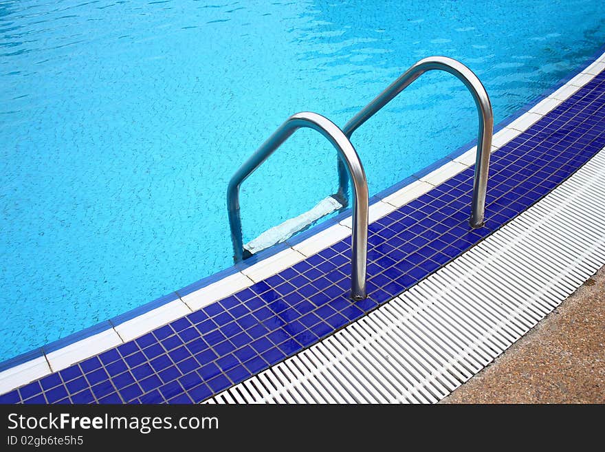 Luxury hotel poolside and ladder