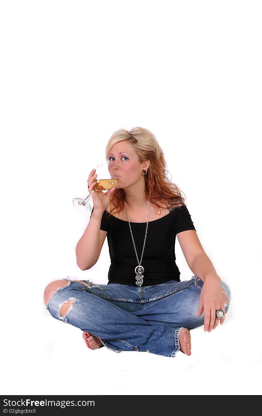 A isolated picture of a woman drinking wine. A isolated picture of a woman drinking wine