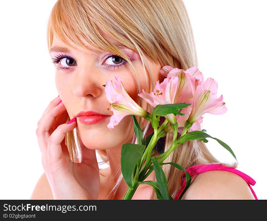 Portrait of a woman holding pink flowers