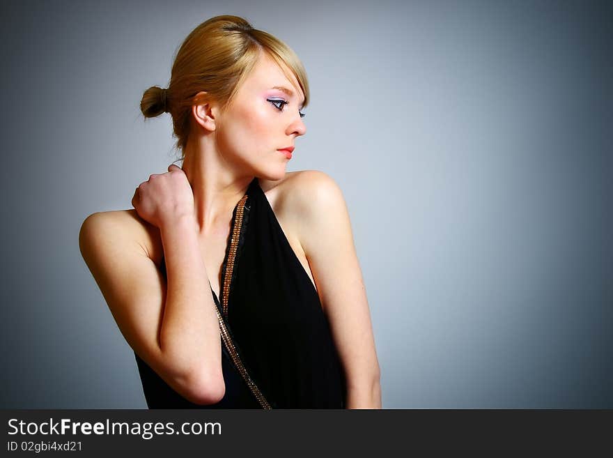 Young woman posing in black dress