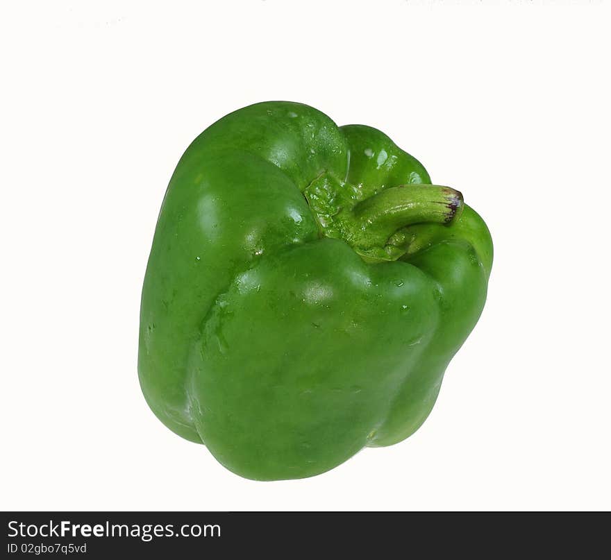 Raw green pepper on the table