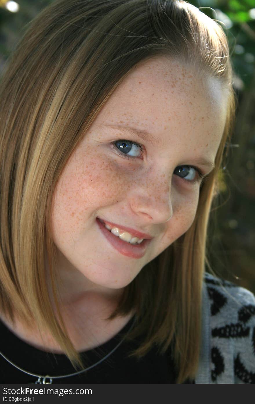 A beautiful white caucasian girl child with a happy expression on her face. A beautiful white caucasian girl child with a happy expression on her face