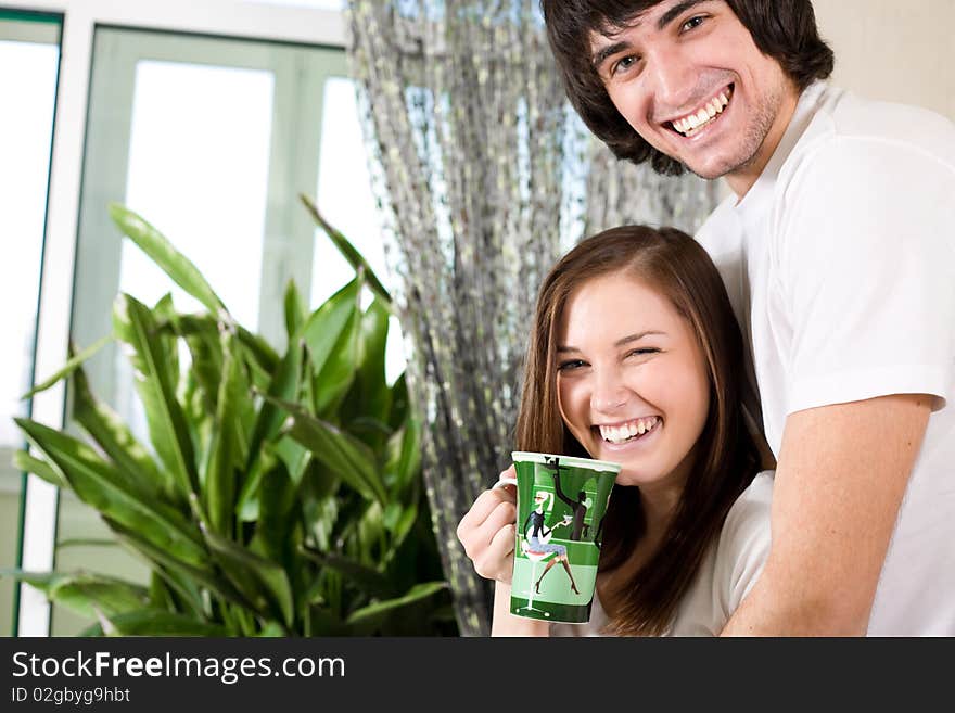 Girl With Long Hair And With Cup And Boy