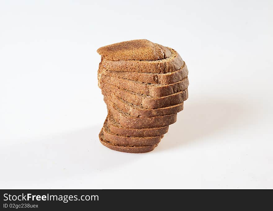 Loaf of bread with grains on a white background