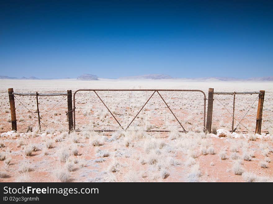 Photo of a gate in the Namibian Desert in Africa. Photo of a gate in the Namibian Desert in Africa