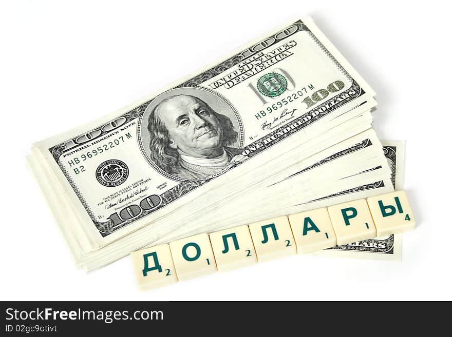 A bundle of money with denominations of one hundred dollars and an inscription in Russian dollars