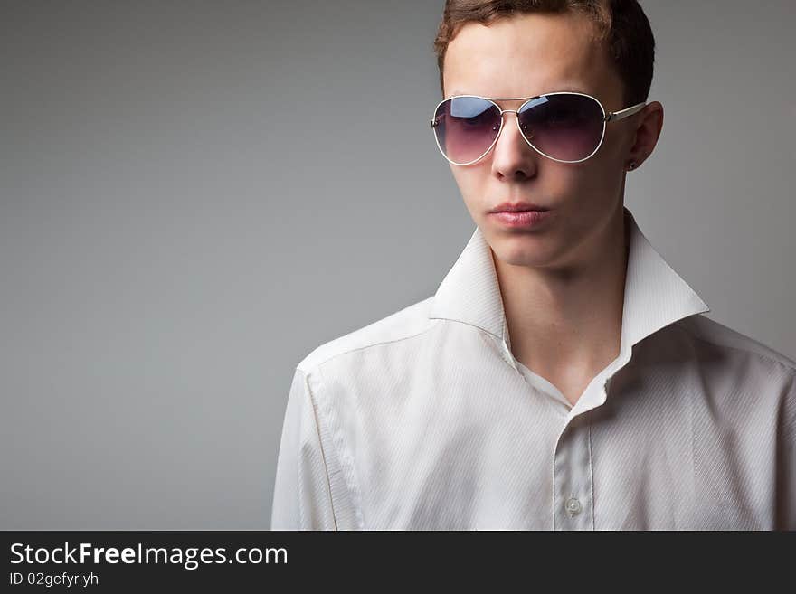 Portrait of young handsome man in sunglasses