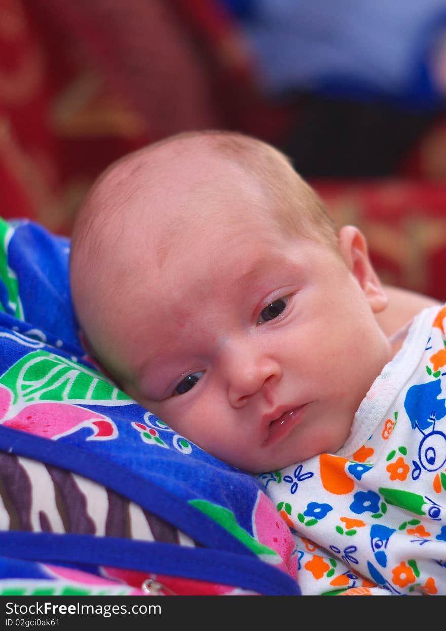 Photo of the baby lying on bed