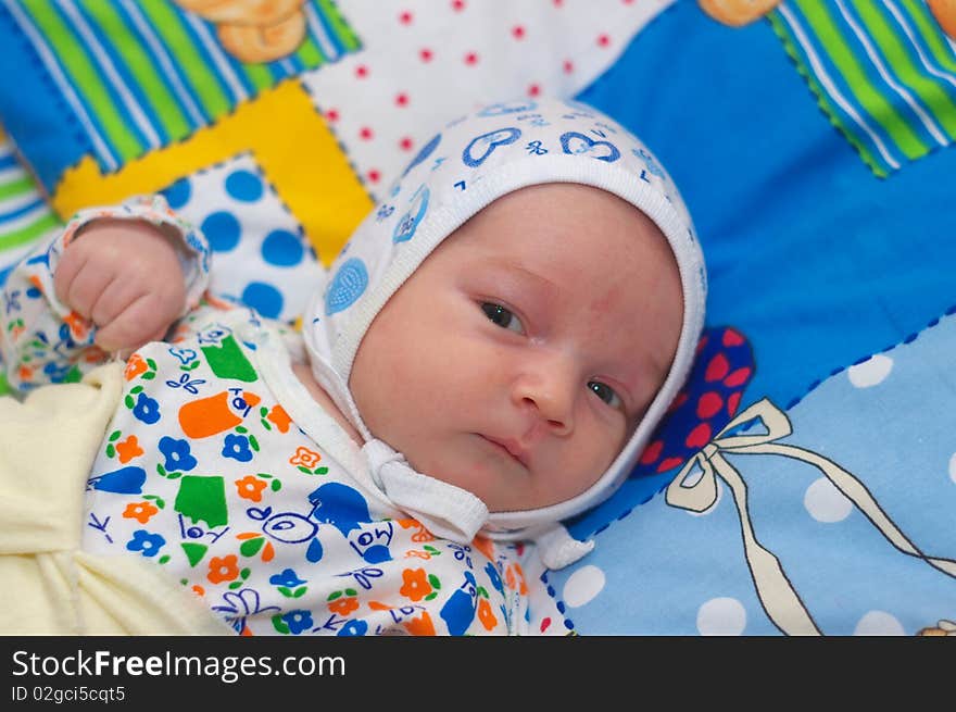 Photo of the baby lying on bed