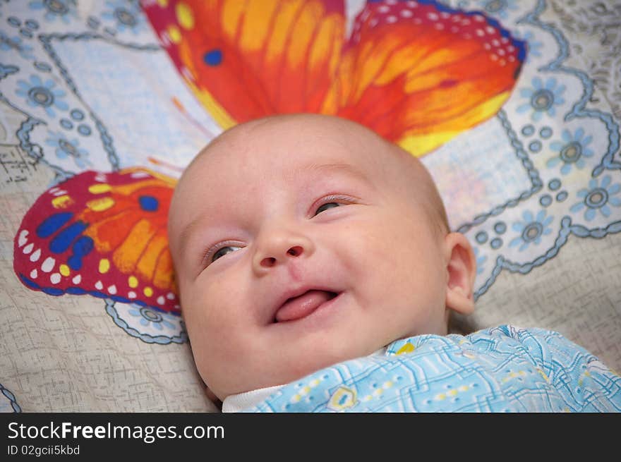 Photo of the baby with smile on face. Photo of the baby with smile on face