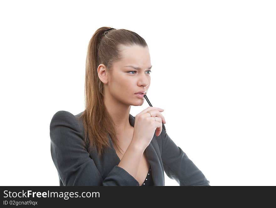 Portrait of young business woman holding pen in her hand, over white background