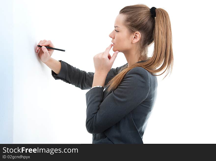 Portrait of young business woman holding pen in her hand, over white background