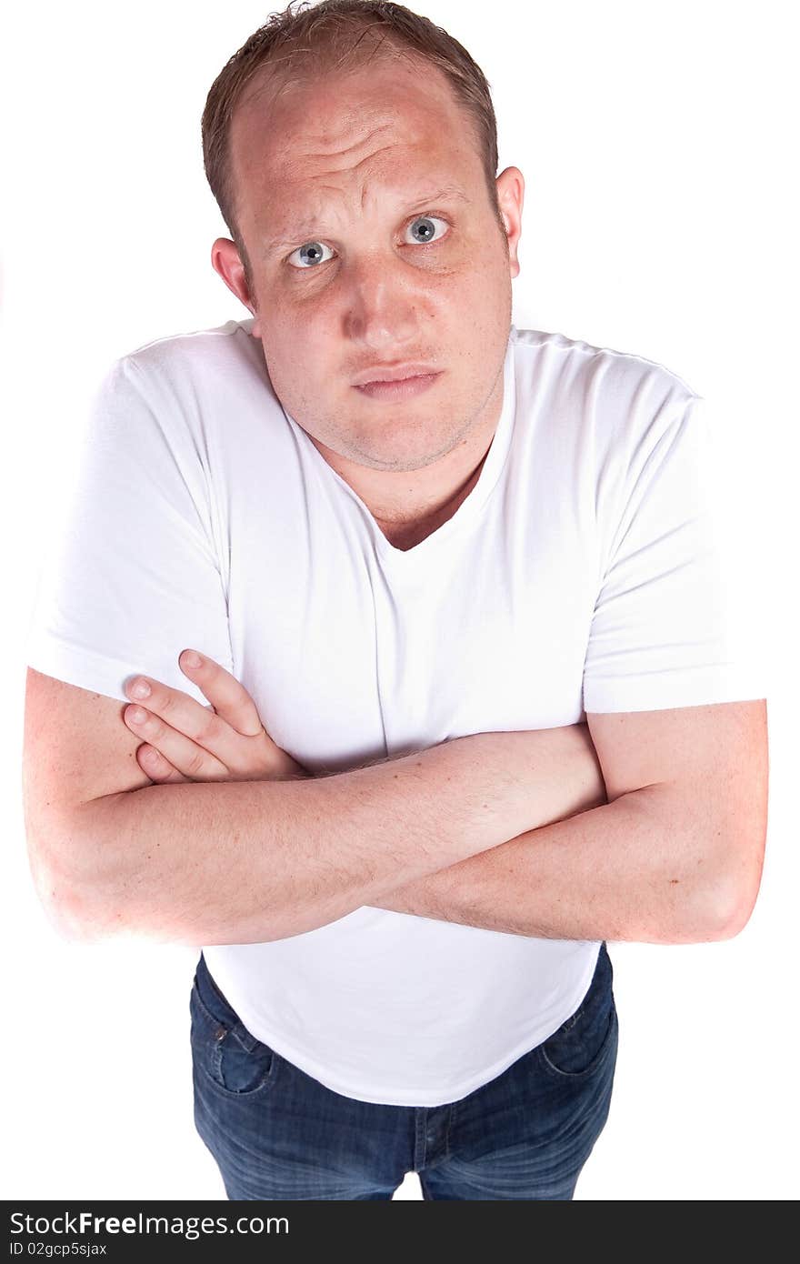 Young confident blond man looking in the camera situated above. Young confident blond man looking in the camera situated above