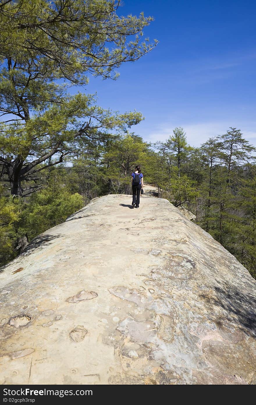 Tourist walking natural bridge